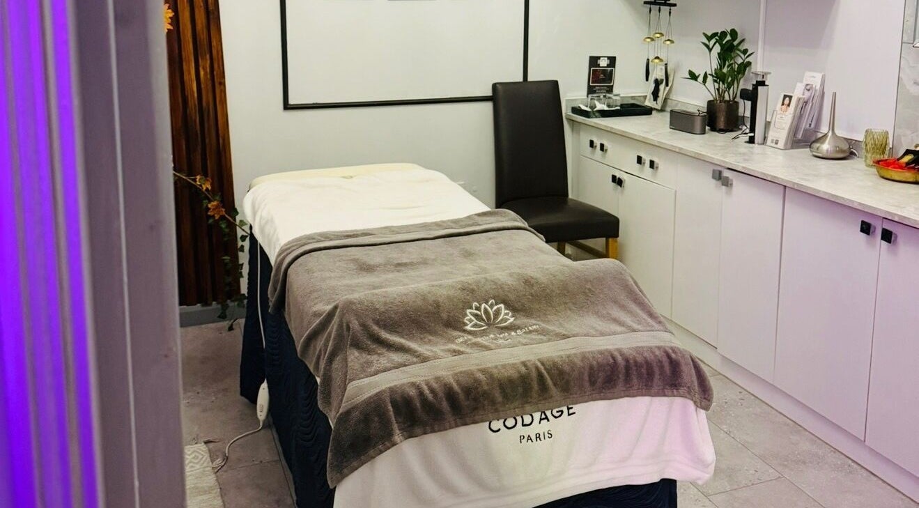 Cozy spa room at Belle Vous Spa Nine Elms, London, England, GB with massage bed and serene decor.