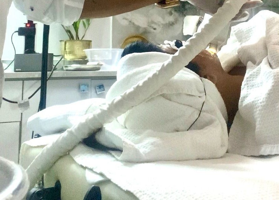 Relaxing facial treatment at Belle Vous Spa Nine Elms, London, England, GB, showcasing luxurious wellness care.