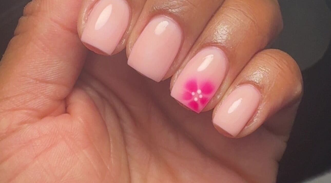 Manicured nails with pink floral design at It’s a Gel Thing, Birmingham, England, GB.