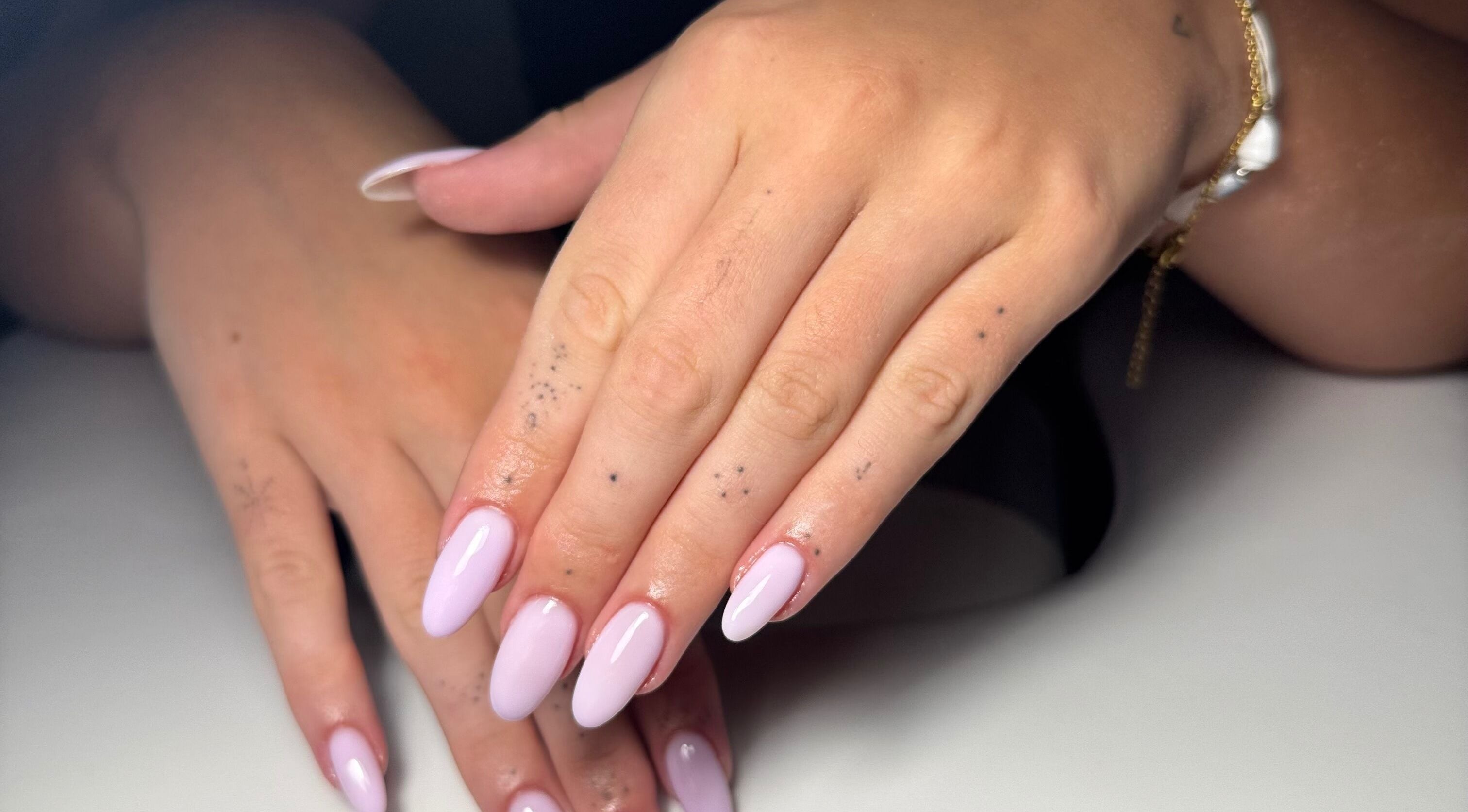 Elegant lavender nails at It’s a Gel Thing, Birmingham, England, GB, showcasing detailed hand artistry.