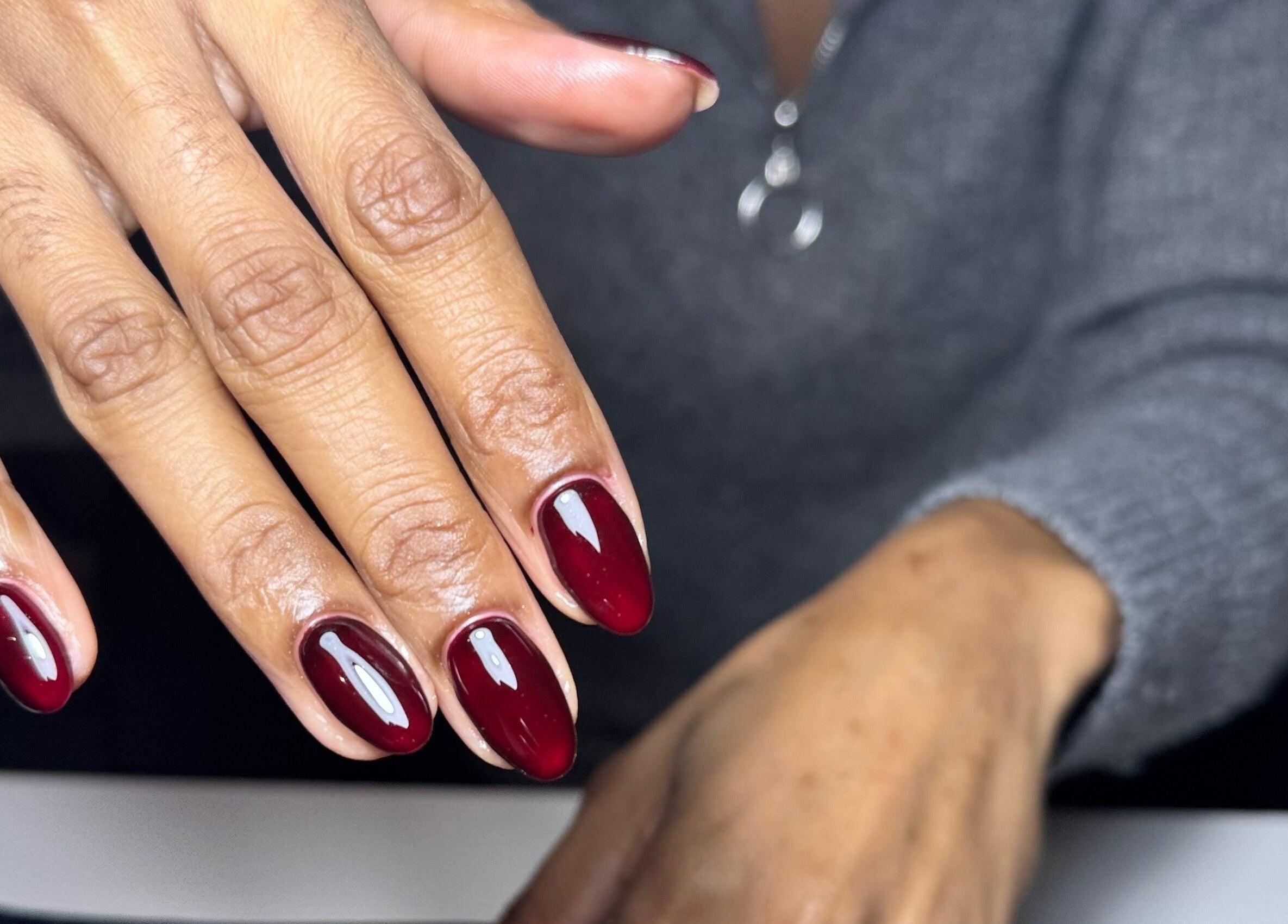 Burgundy gel nails at It’s a Gel Thing, Birmingham, England, GB showcase elegant manicure.