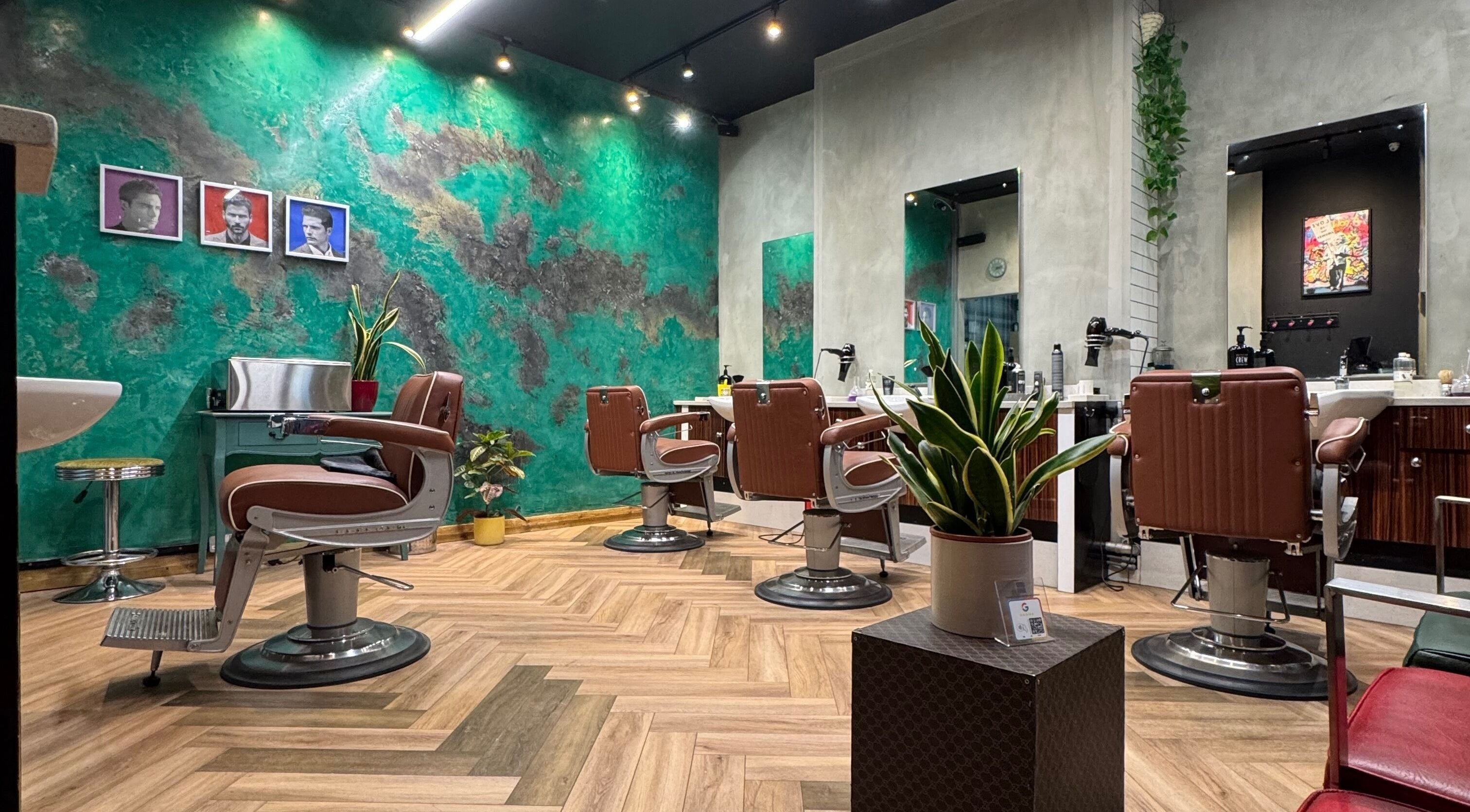 Chic interior of Midtown Barbers | Hairform For Men, London, England, GB, with modern chairs and vibrant decor.