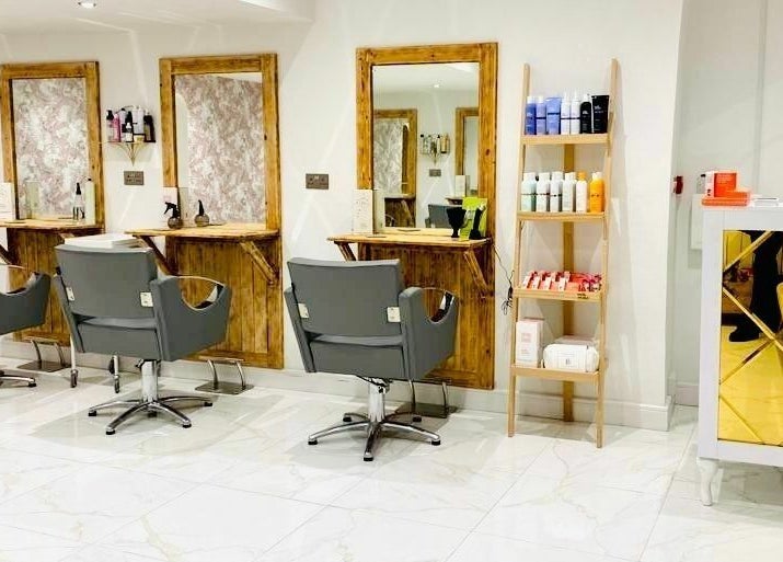 Modern salon interior at Jade Slater Hair Design in York, England, GB featuring stylish chairs and elegant decor.