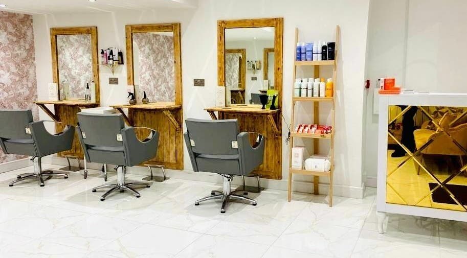 Modern salon interior at Jade Slater Hair Design in York, England, GB featuring stylish chairs and elegant decor.