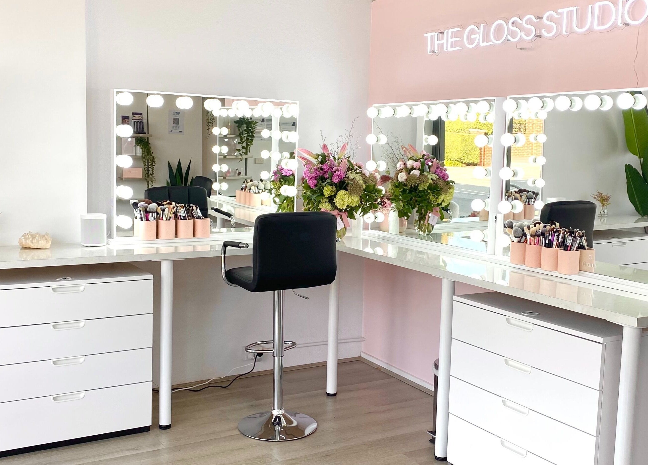 Luxurious makeup stations at The Gloss Studio in Lower Plenty, VIC, AU featuring elegant mirrors and decor.