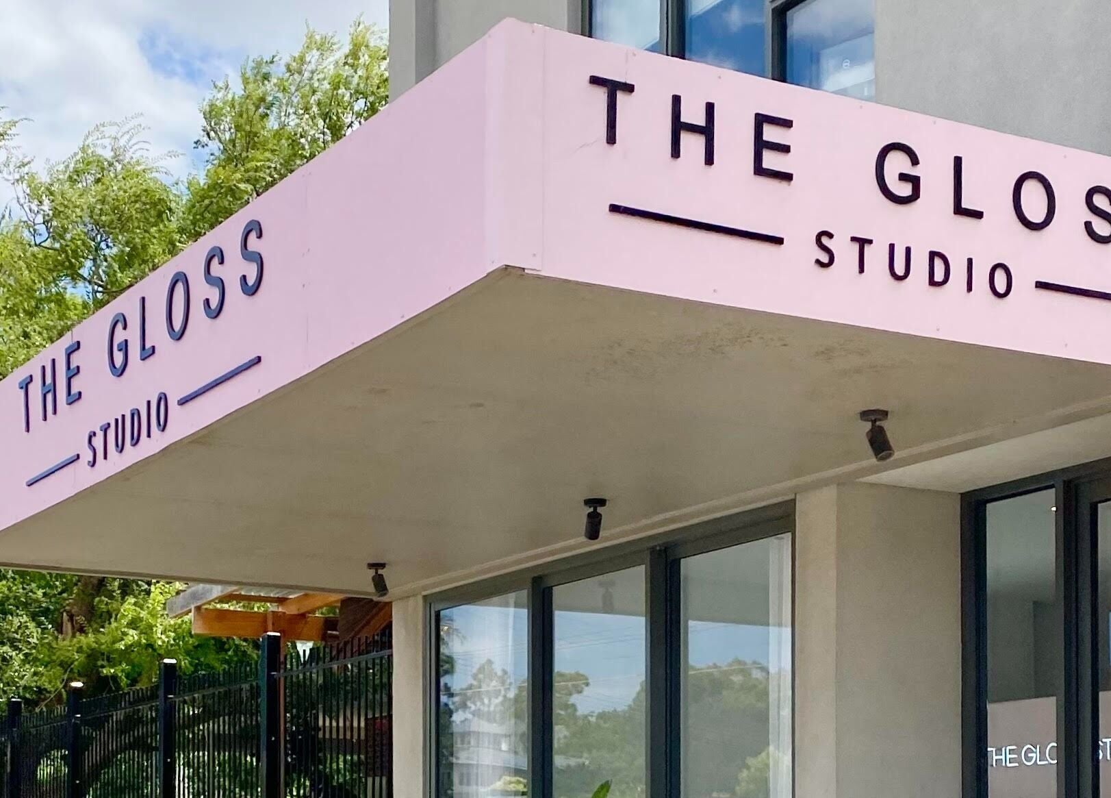 The Gloss Studio's modern exterior in Lower Plenty, VIC, AU, showcasing a stylish pink facade.