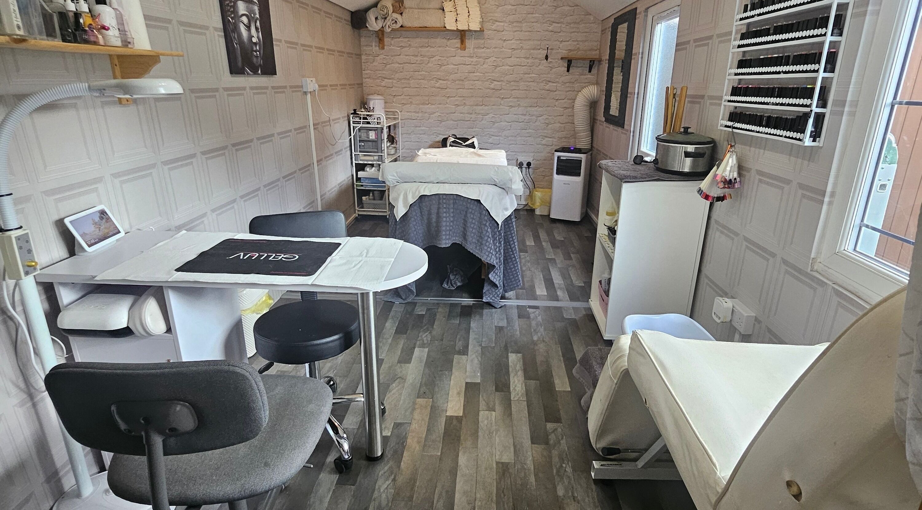 Relaxing treatment room at Revive Hair & Beauty Salon in Rugeley, England, GB, featuring a modern, tranquil setup.