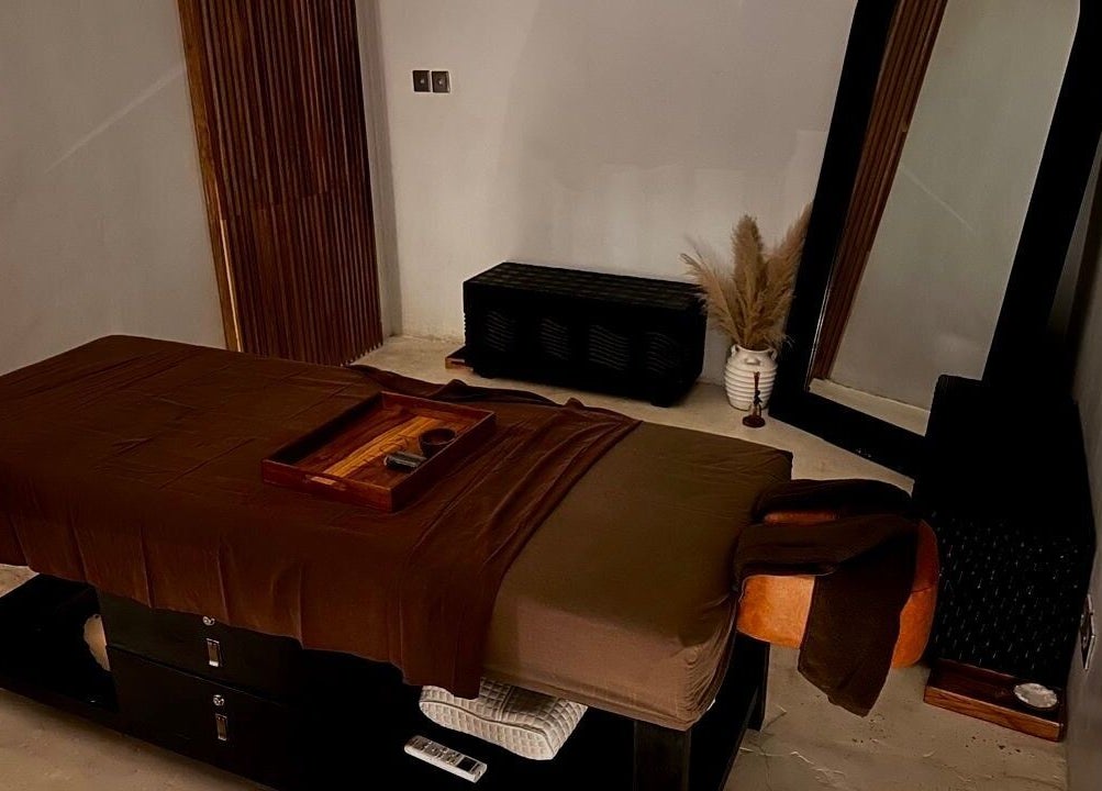 Tranquil massage room at Koya Spa, Bali, Bali, ID featuring a cozy massage table and soothing decor.