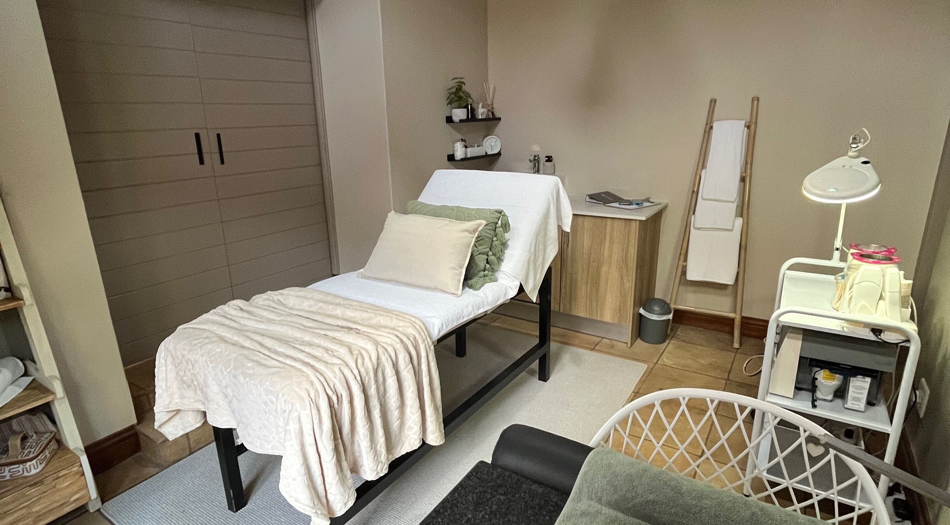 Calming treatment room at Reluxskin, Pretoria, Gauteng, ZA with a massage bed and ambient lighting.