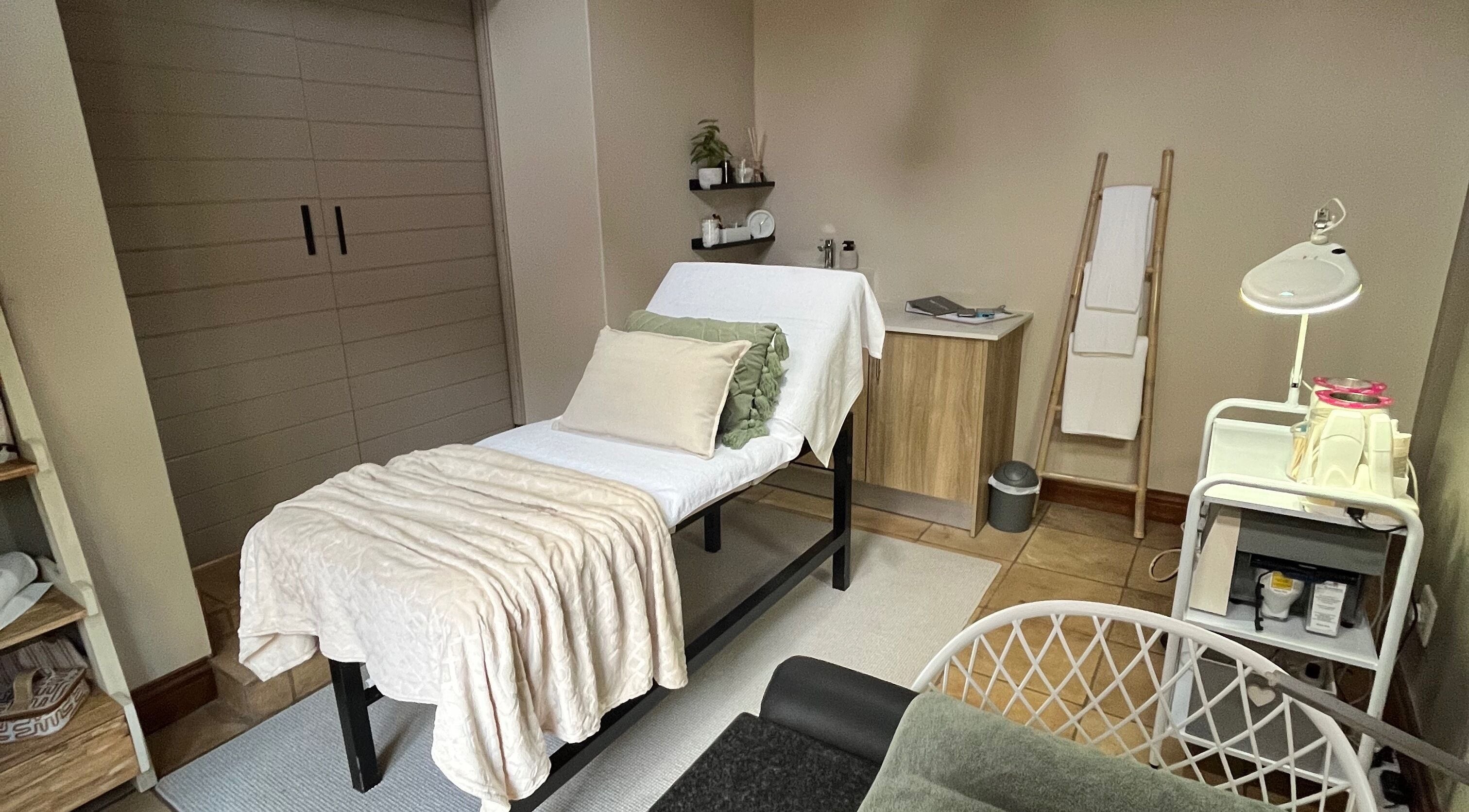 Calming treatment room at Reluxskin, Pretoria, Gauteng, ZA with a massage bed and ambient lighting.