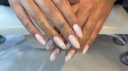 Styled nails at Annabelle’s Beauty, Camberley, England, GB featuring soft pink shades with star designs.