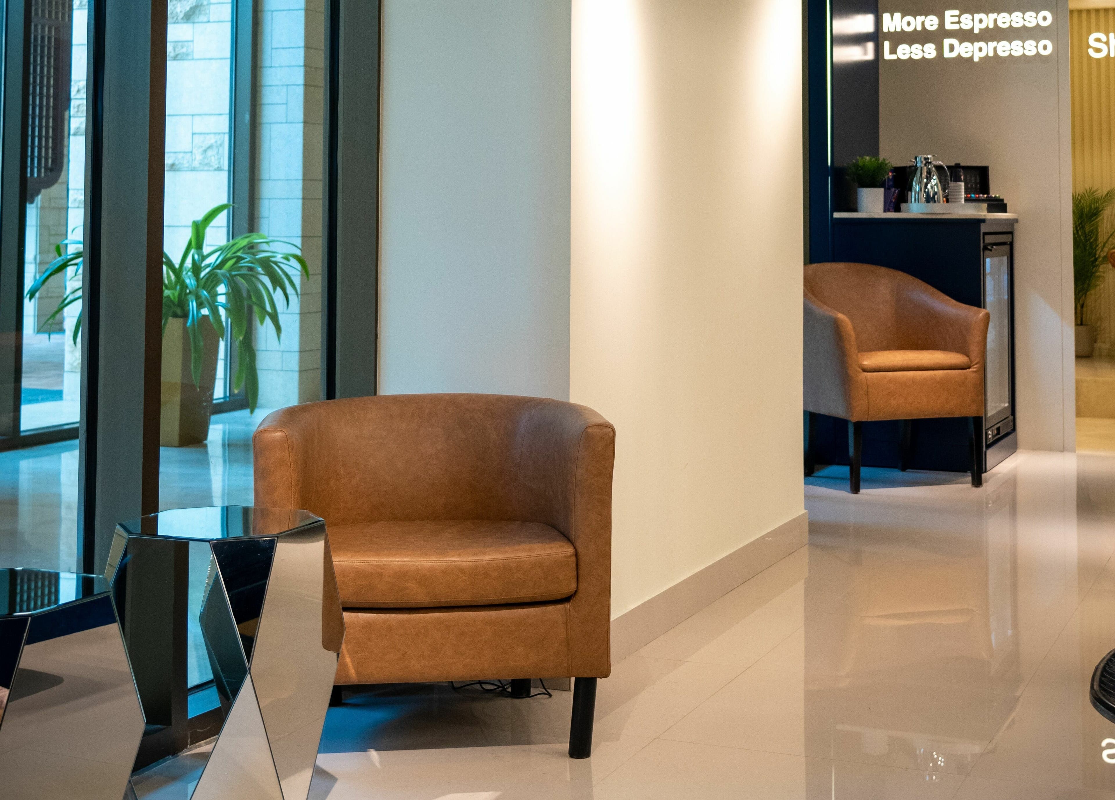 Cozy seating in Shuffle Gents Barber, Mubarak Al-kabeer, showcasing modern design and comfort.