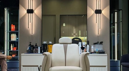 Elegant barber chair at SHUFFLE Gents Salon Hessah District, Al Asimah Governate, KW, beautifully lit interior.