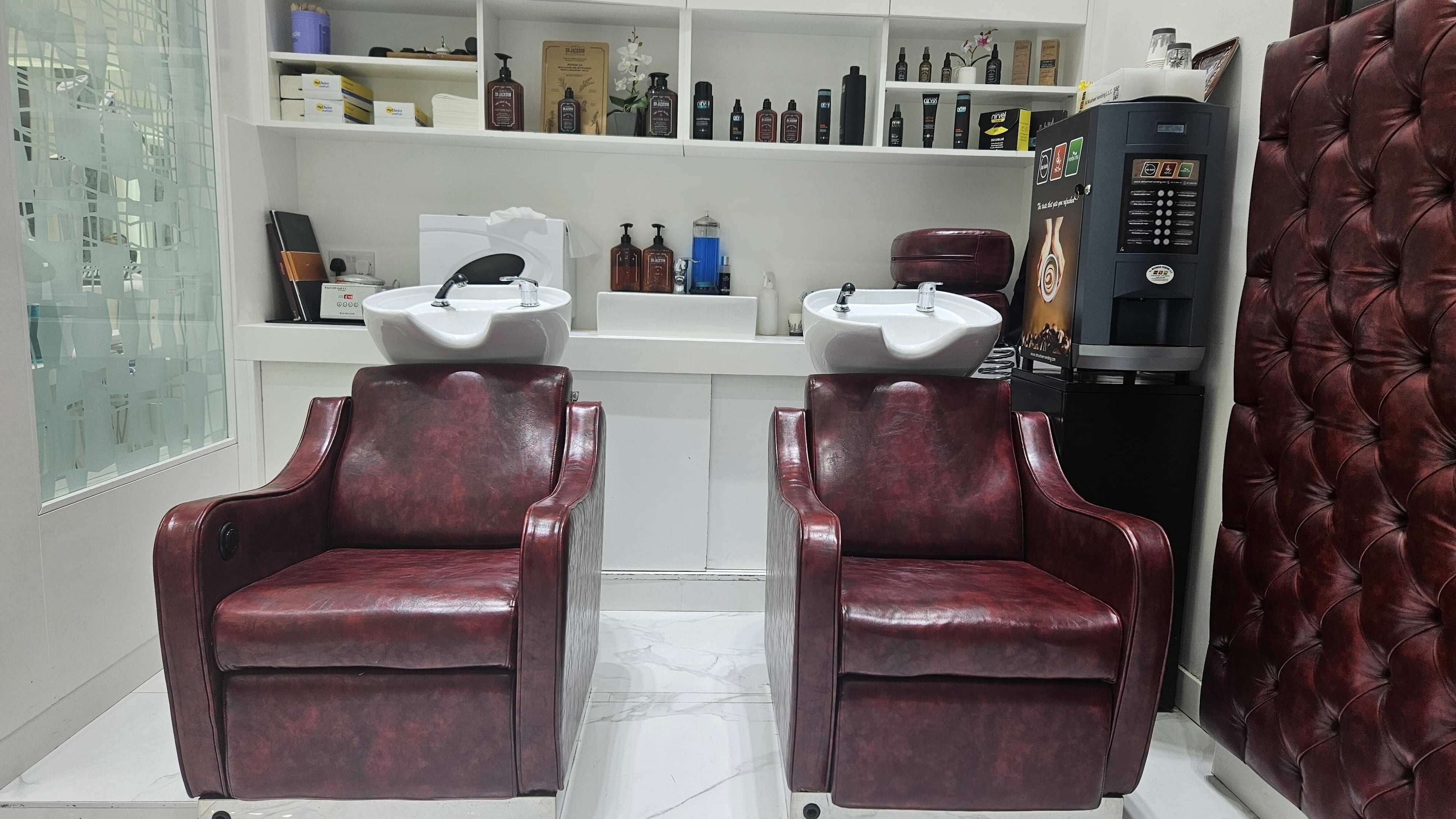 Luxurious barber chairs at Groomen Barbershop - Ibn Battuta Mall, Dubai, Dubai, AE offer comfort and style.