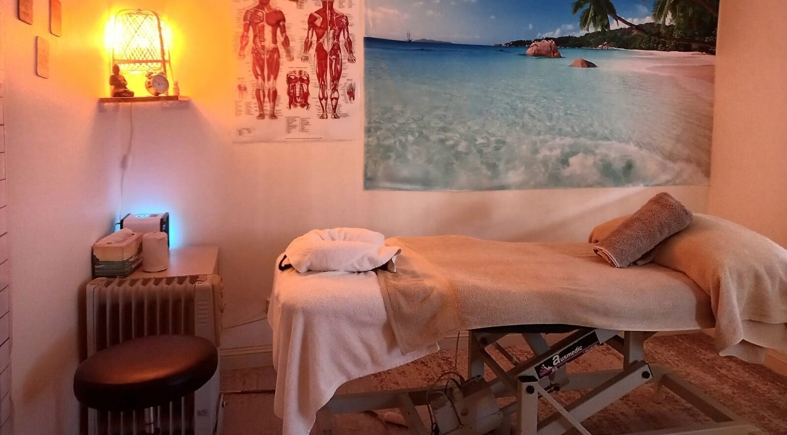 Tranquil massage room at Live Life Massage & Yoga, Maroubra, New South Wales, AU with beach mural.