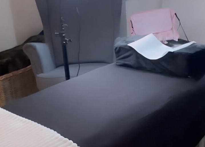 A relaxing treatment room at Lashes by Valeria in Birmingham, England, GB, featuring a cozy massage table.