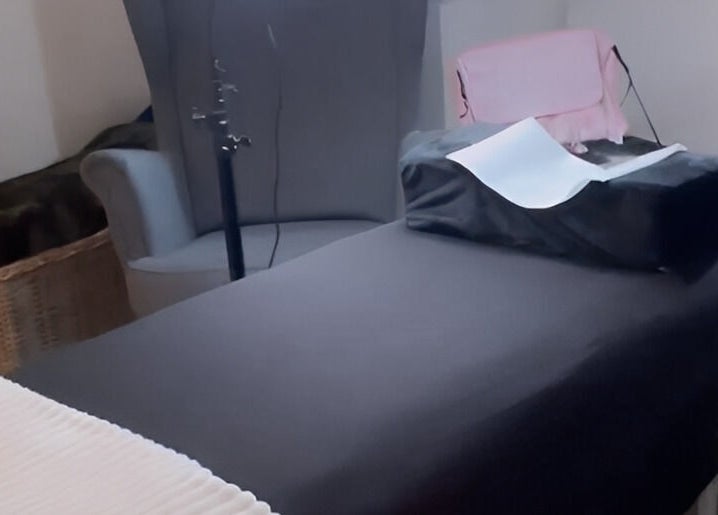 A relaxing treatment room at Lashes by Valeria in Birmingham, England, GB, featuring a cozy massage table.