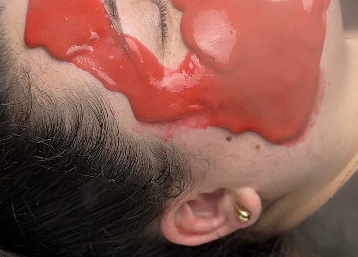 Relaxing facial treatment at Afterglow Beauty, Cambridge, England, GB, featuring a rejuvenating red mask.