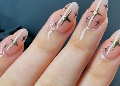 Starry delicate nail art at Afterglow Beauty in Cambridge, England, GB features elegant sparkles on glossy finish.
