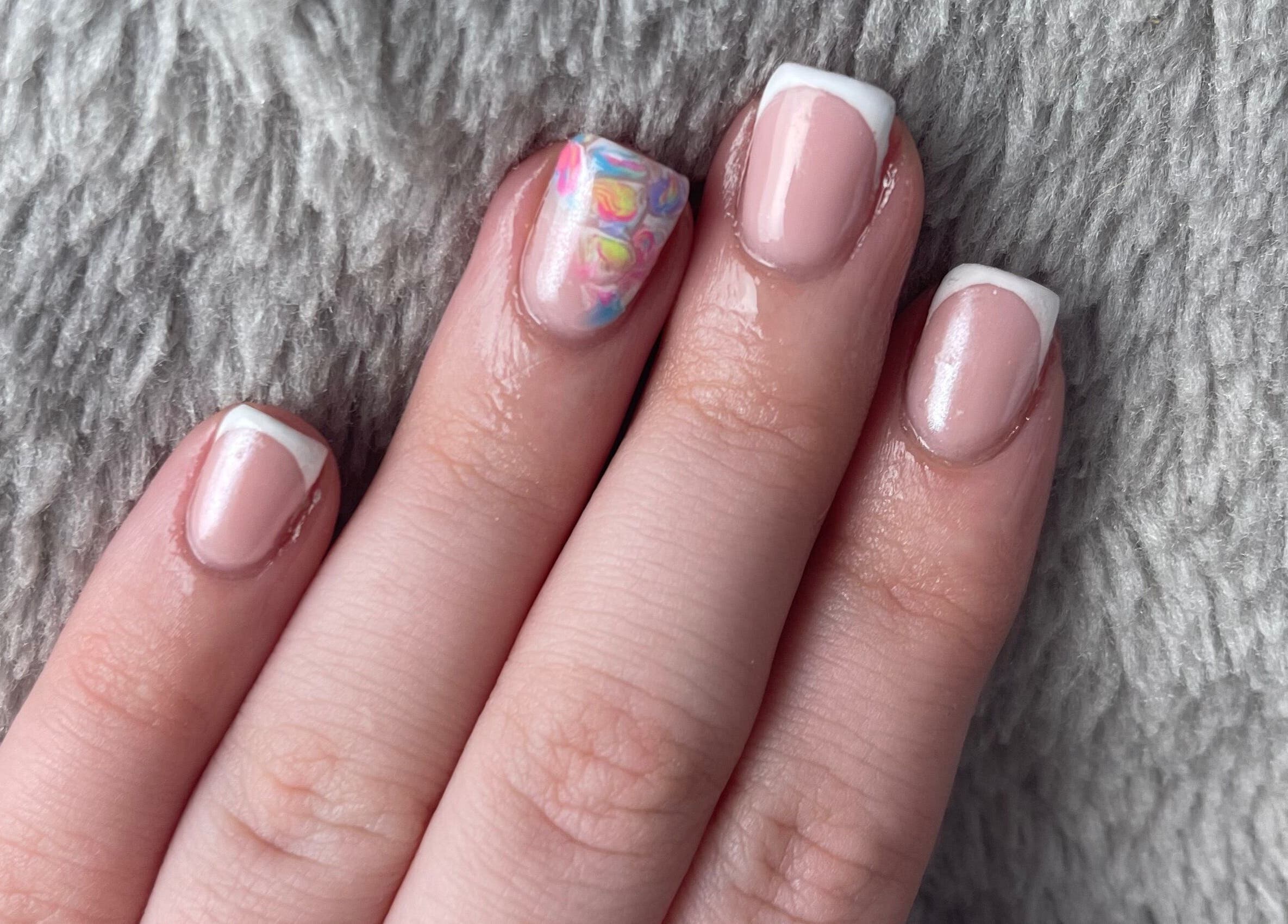 Elegant French manicure with colorful accent nail at Afterglow Beauty, Cambridge, England, GB.