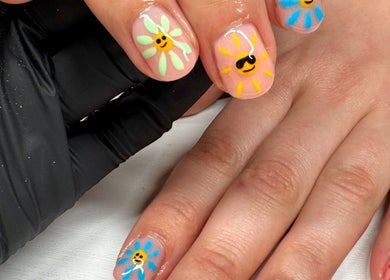 Vibrant floral nail art at Afterglow Beauty, Cambridge, England, GB. Detailed hand-painted designs.