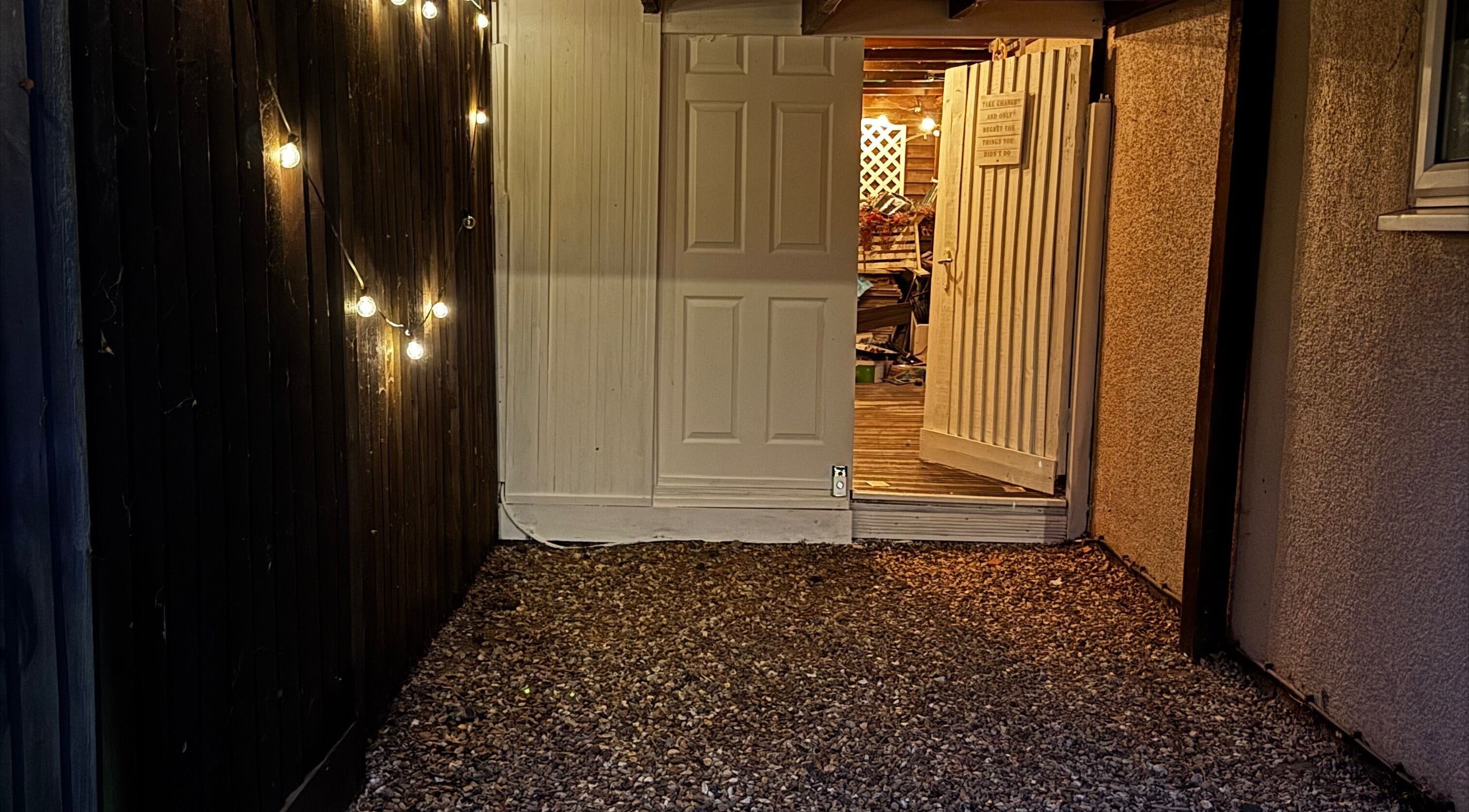 Charming entrance with string lights at Afterglow Beauty, Cambridge, England, GB.