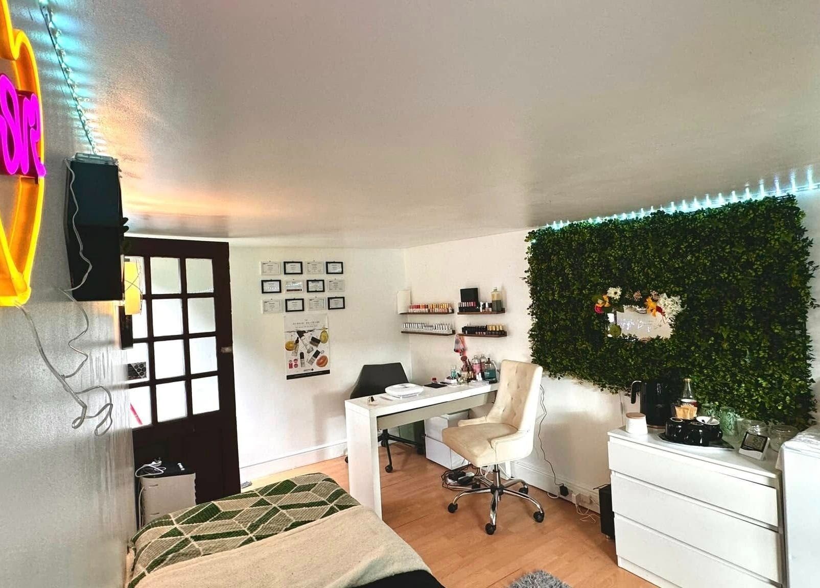 Trendy interior at Afterglow Beauty in Cambridge, England, GB with neon lights and lush decor for relaxation.