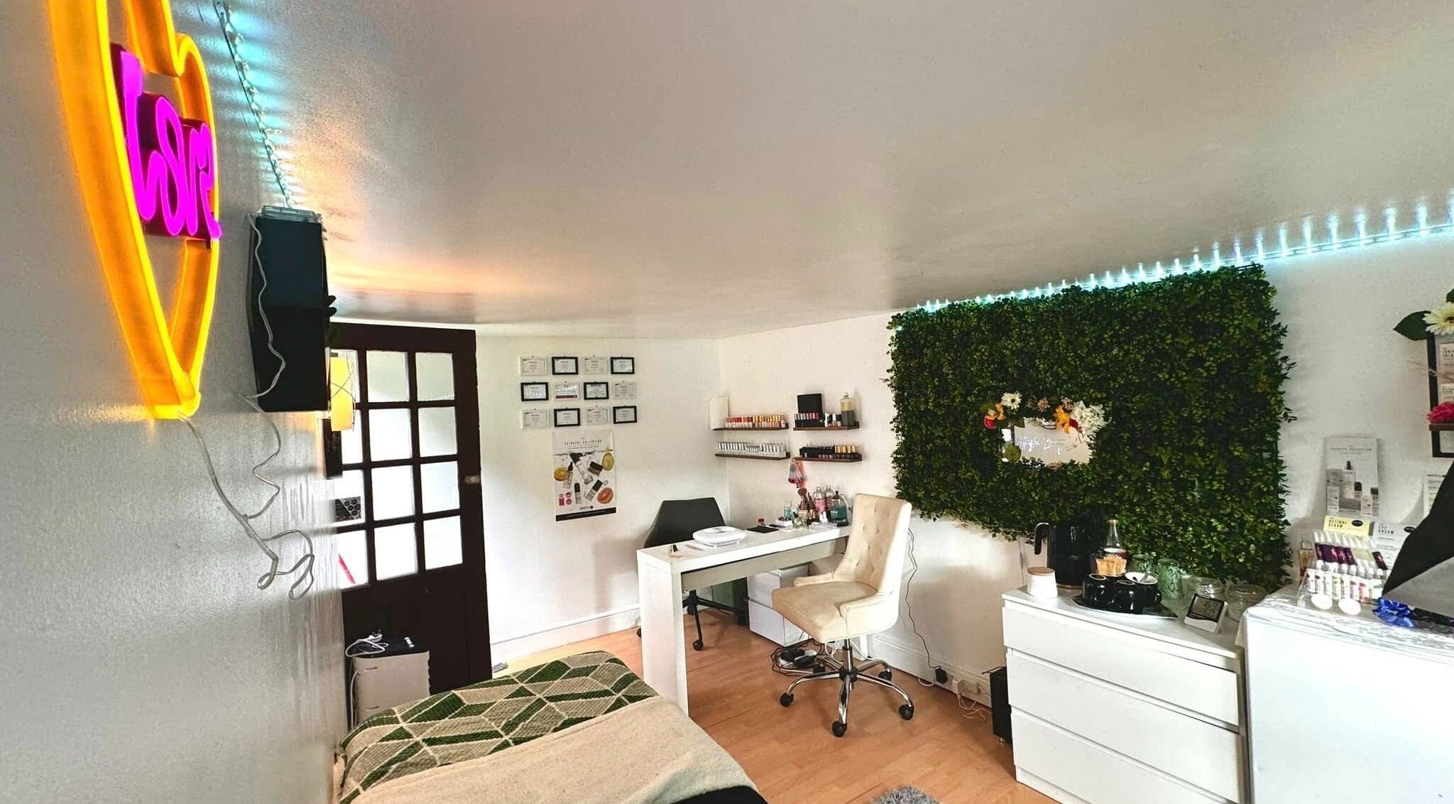 Trendy interior at Afterglow Beauty in Cambridge, England, GB with neon lights and lush decor for relaxation.