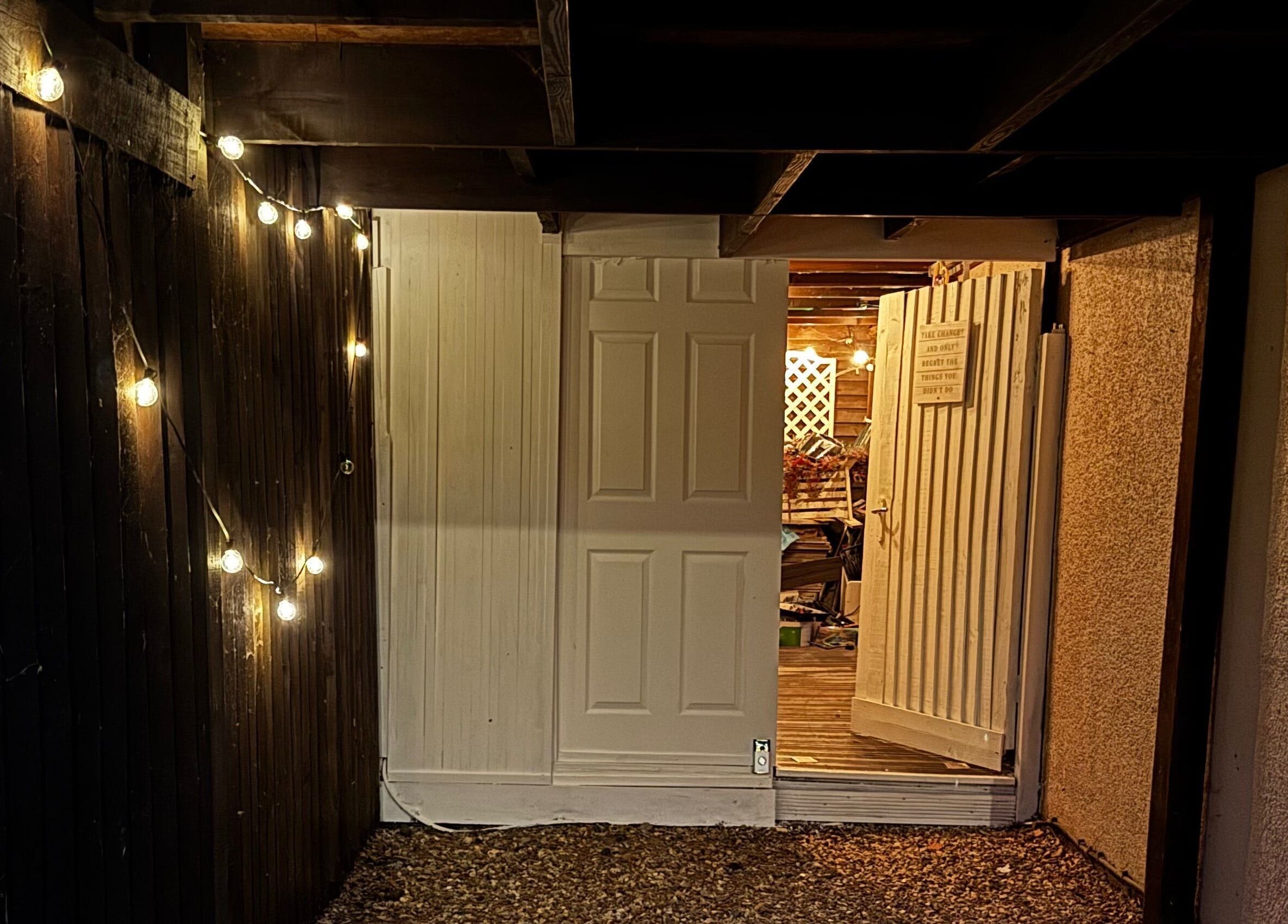 Warmly lit entrance at Afterglow Beauty, Cambridge, England, GB, featuring ambient string lights.