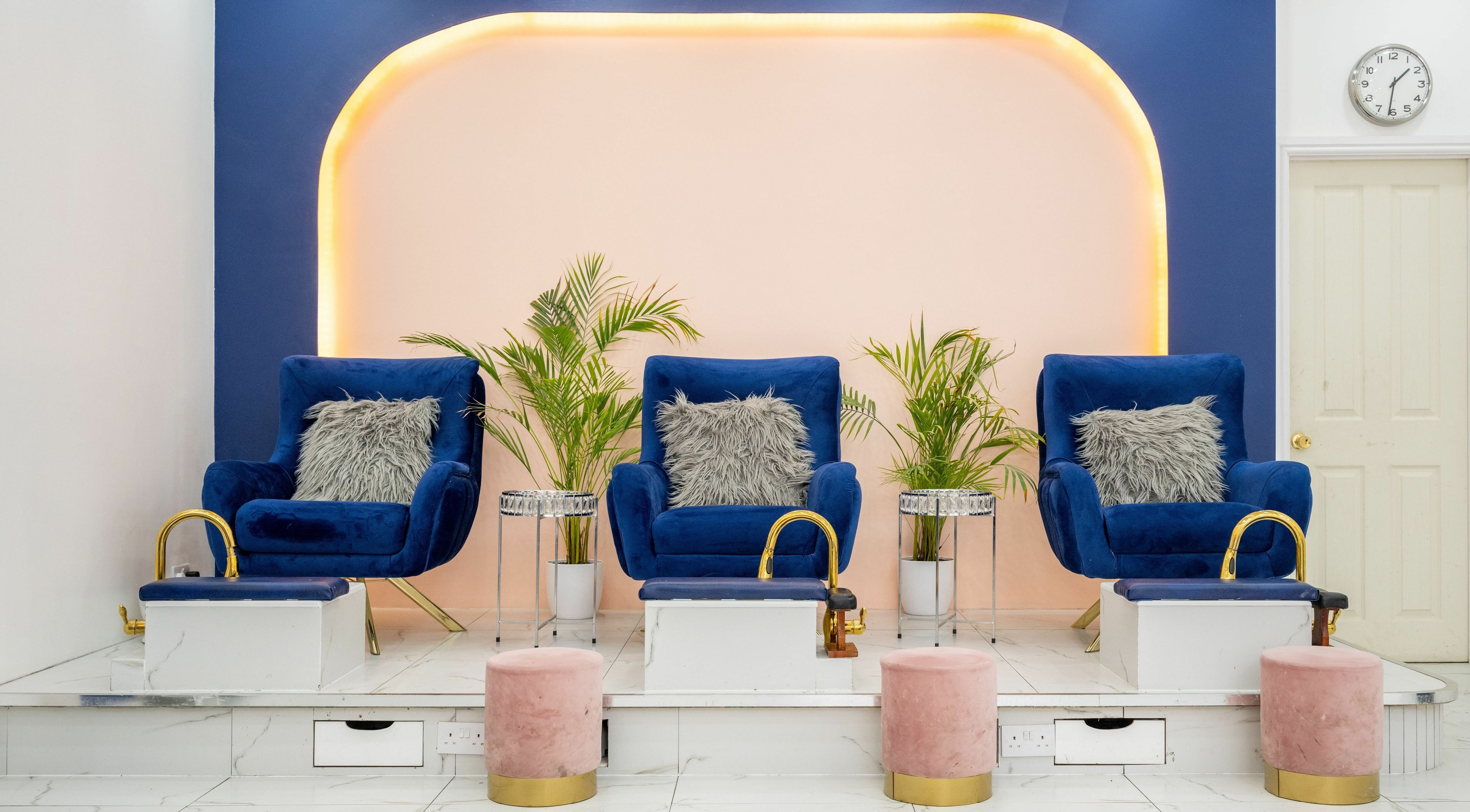 Elegant pedicure chairs at Vanity Nail Bar, Brierley Hill, England, GB, with plush seating and lush plants.