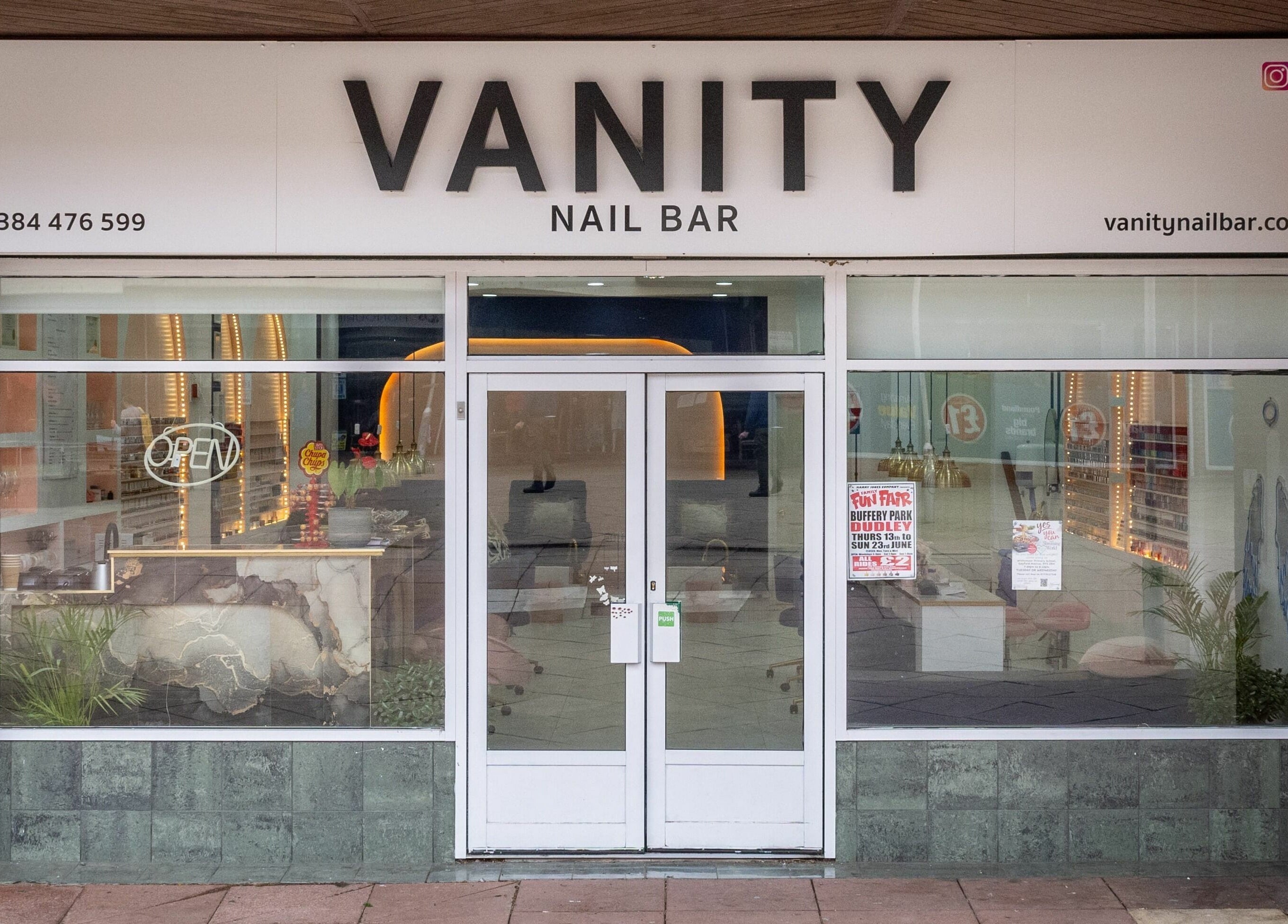 Front view of Vanity Nail Bar in Brierley Hill, England, GB showcasing modern storefront.