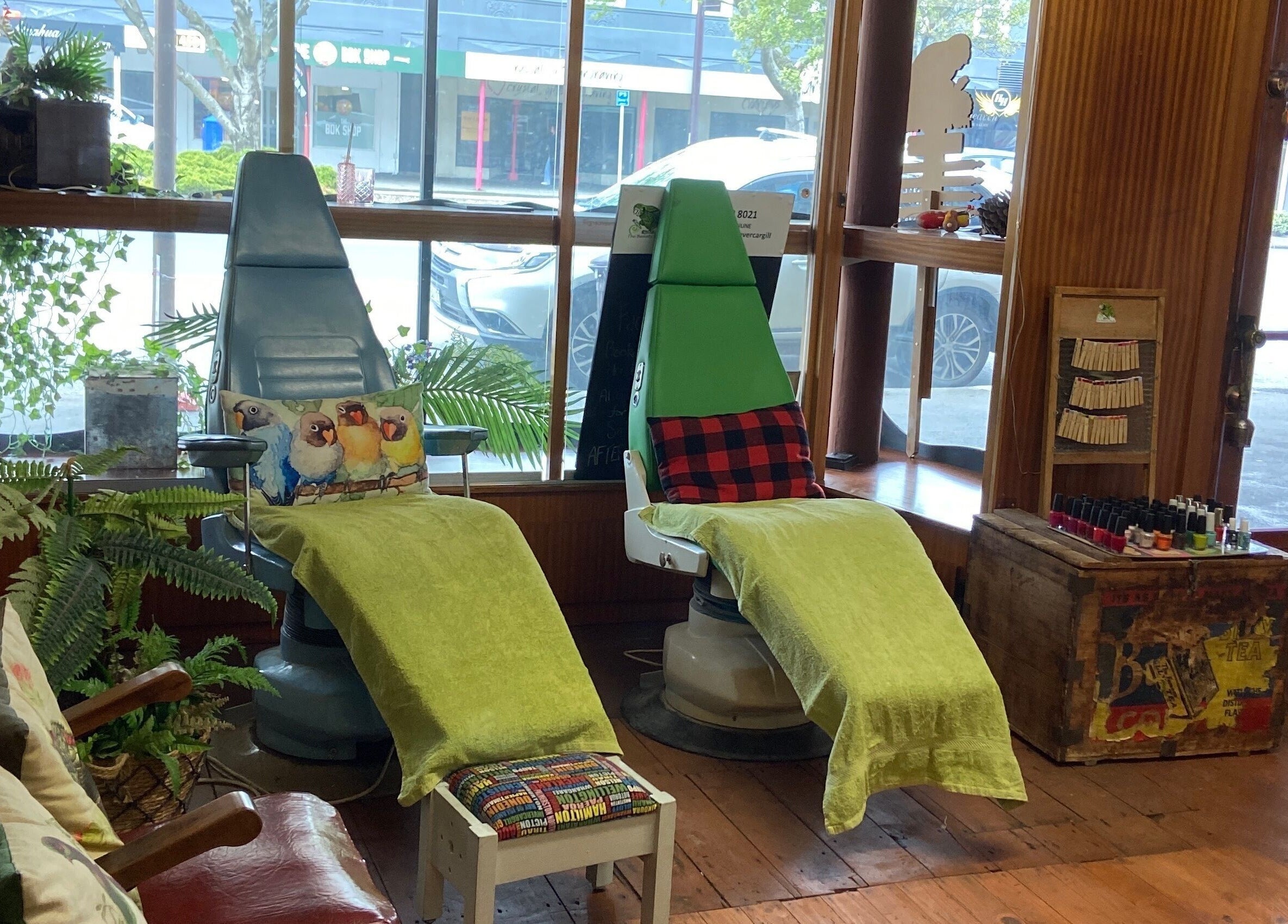 Comfortable spa chairs with vibrant pillows at The Beauty Bach Invers, Invercargill, Southland Region, NZ.
