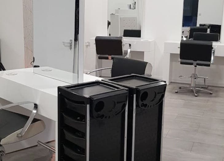 Sleek hair styling stations at Emily H at Roots, Windsor, England, GB, designed for premium beauty experiences.