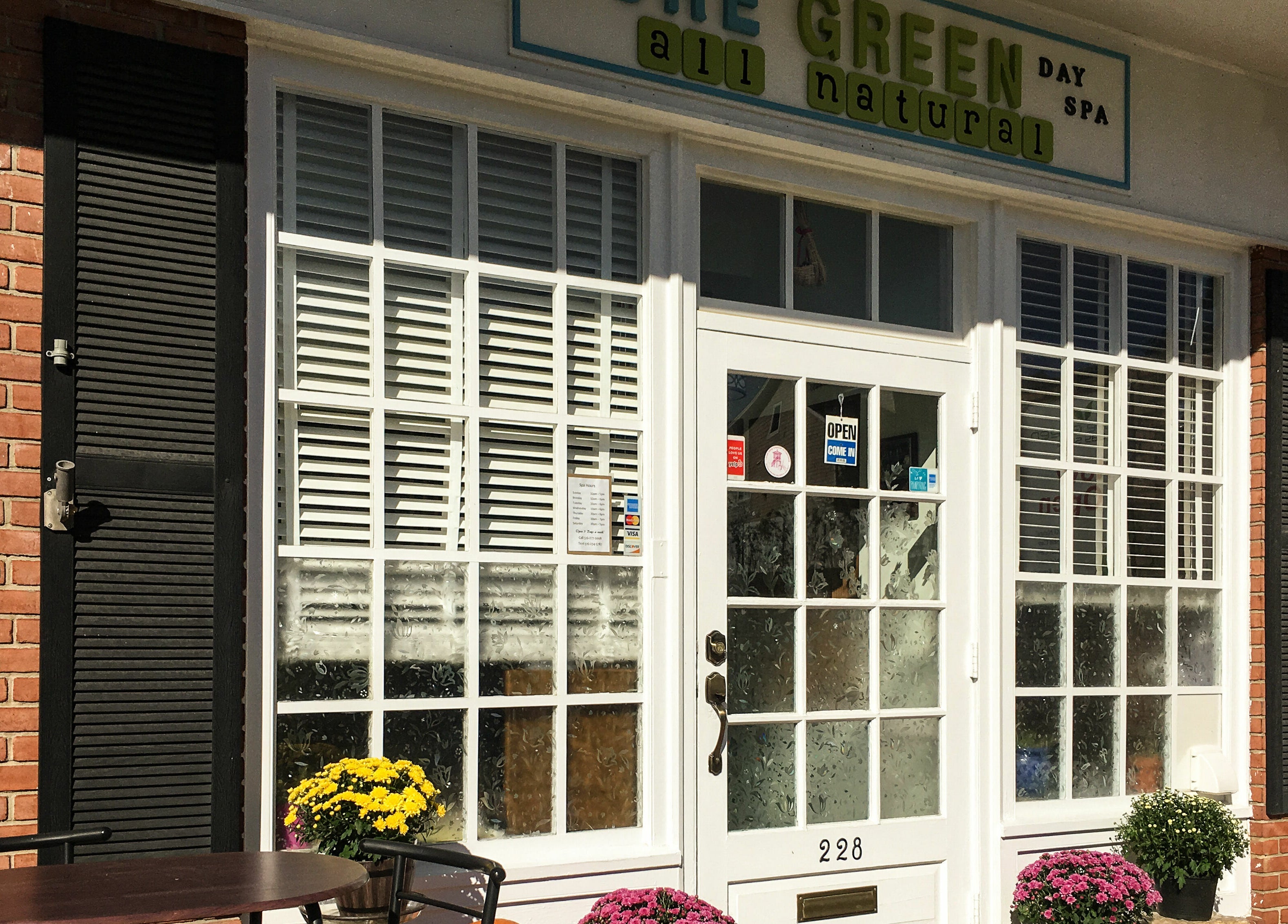 Exterior of Pure Green Locust Valley, a tranquil spa in Locust Valley, New York, US, with welcoming decor.