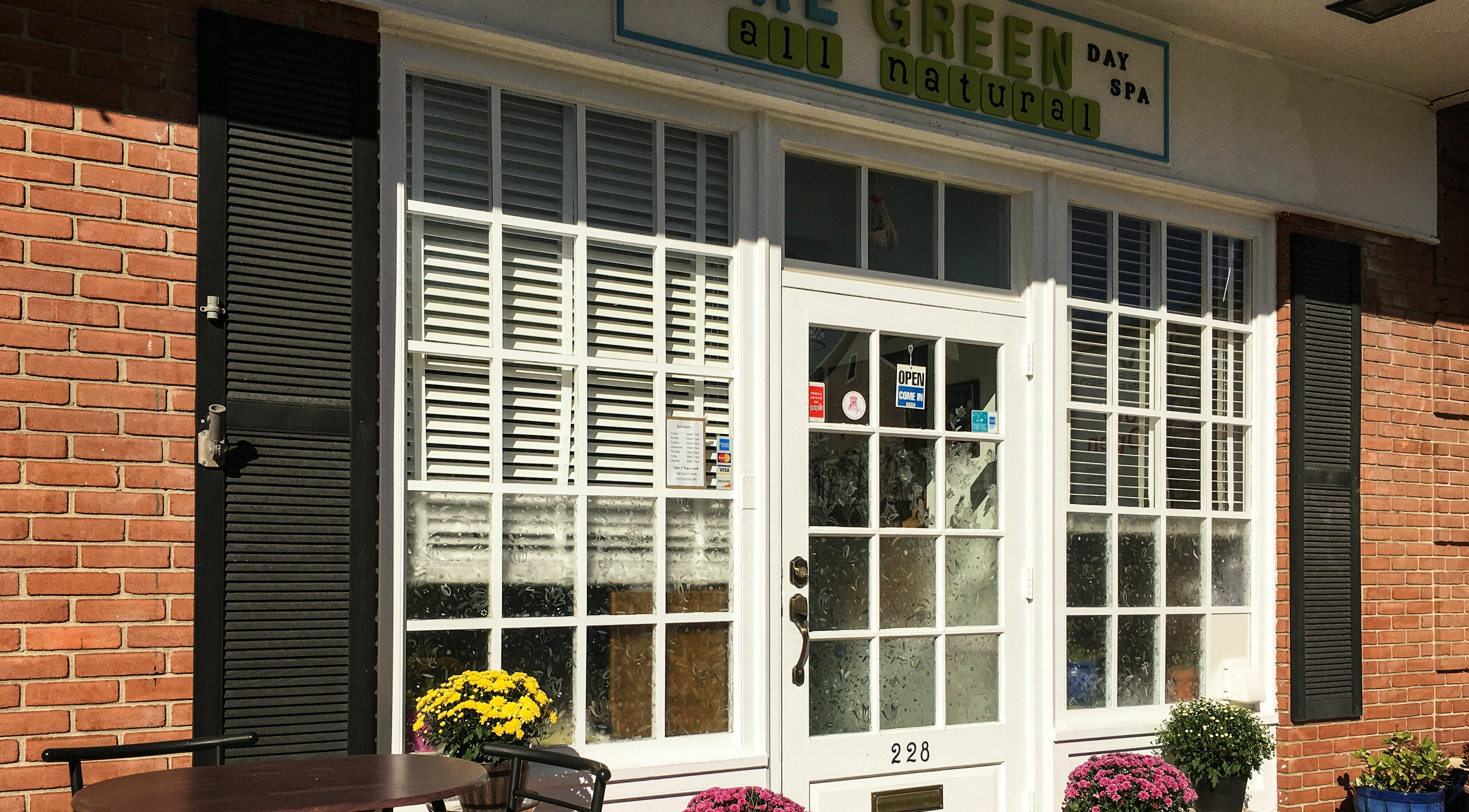 Exterior of Pure Green Locust Valley, a tranquil spa in Locust Valley, New York, US, with welcoming decor.