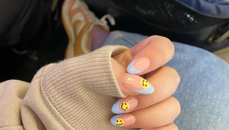 Cute smiley nail art at Mielyque Nails, Stellenbosch, Western Cape, ZA. Bright and trendy design.