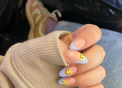 Cute smiley nail art at Mielyque Nails, Stellenbosch, Western Cape, ZA. Bright and trendy design.