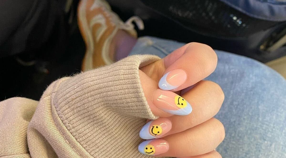 Cute smiley nail art at Mielyque Nails, Stellenbosch, Western Cape, ZA. Bright and trendy design.