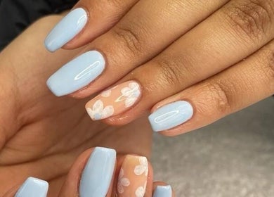 Elegant pastel blue nails with floral art at Mielyque Nails, Stellenbosch, Western Cape, ZA.