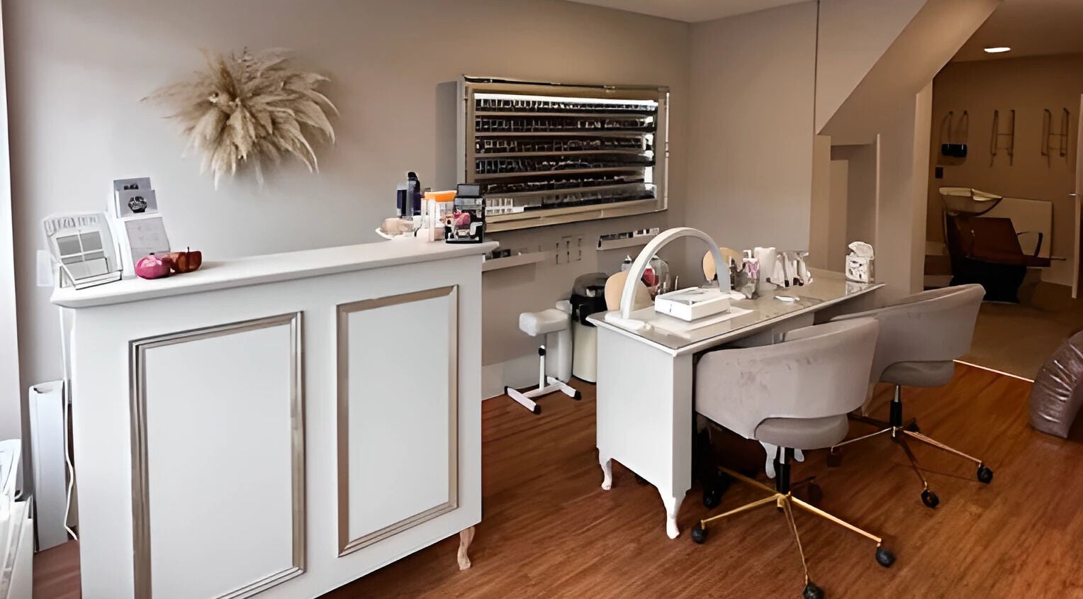 Elegant reception and nail stations at Beauty by Jo & Co, Adlington, England, GB.