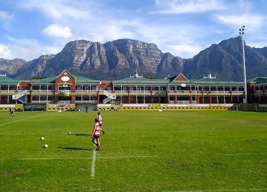 Scenic view of Villagers Football Club's sports field in Cape Town, Western Cape, ZA with mountain backdrop.