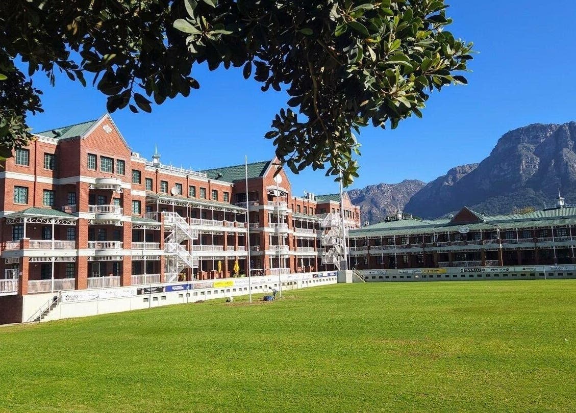 Scenic view of heritage building at Villagers Football Club, Cape Town, Western Cape, ZA with mountain backdrop.