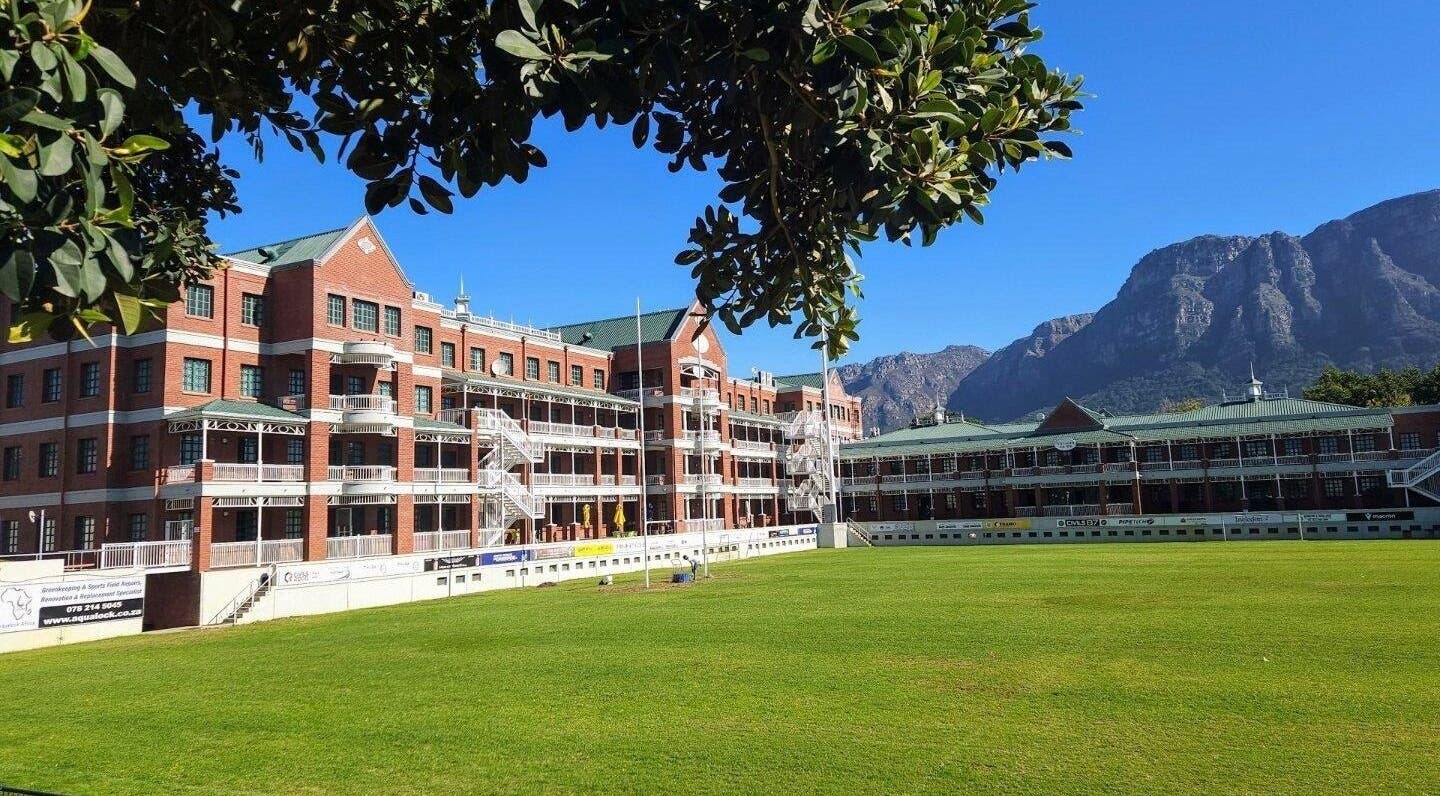 Scenic view of heritage building at Villagers Football Club, Cape Town, Western Cape, ZA with mountain backdrop.