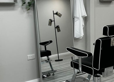 Elegant black salon chair at SCULPT, Newry, Northern Ireland, GB reflecting a modern aesthetic.