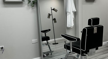 Elegant black salon chair at SCULPT, Newry, Northern Ireland, GB reflecting a modern aesthetic.