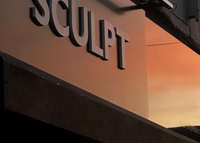 Sculpt salon sign at sunset in Newry, Northern Ireland, GB, showcasing elegant exterior.