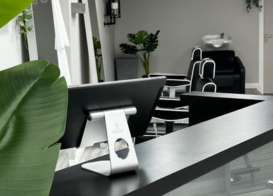 Modern reception area at Sculpt, Newry, Northern Ireland, GB with sleek design and lush plants.