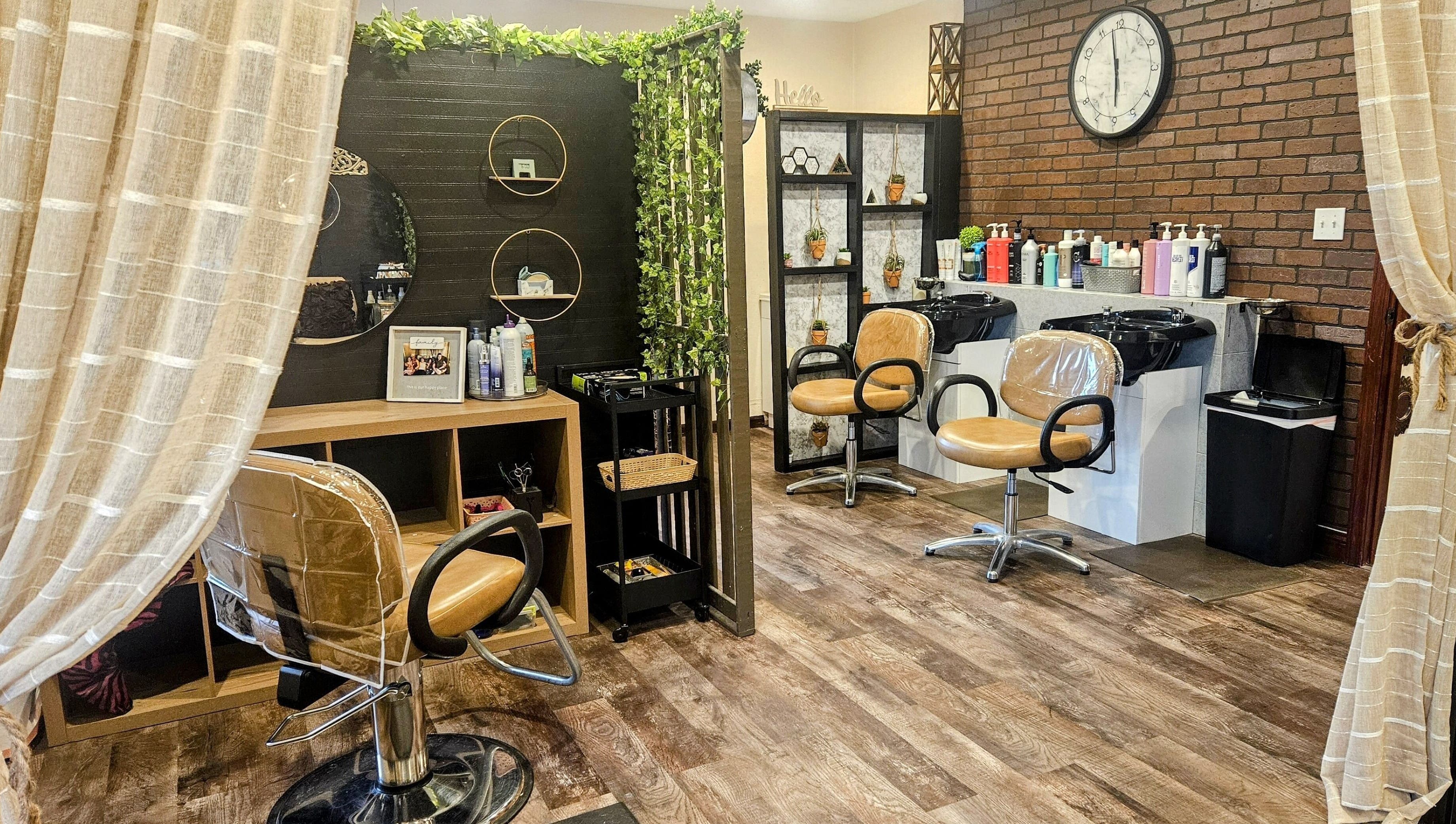 Cozy salon interior at Simply Suite, Lima, Ohio, US with stylish chairs and decor.