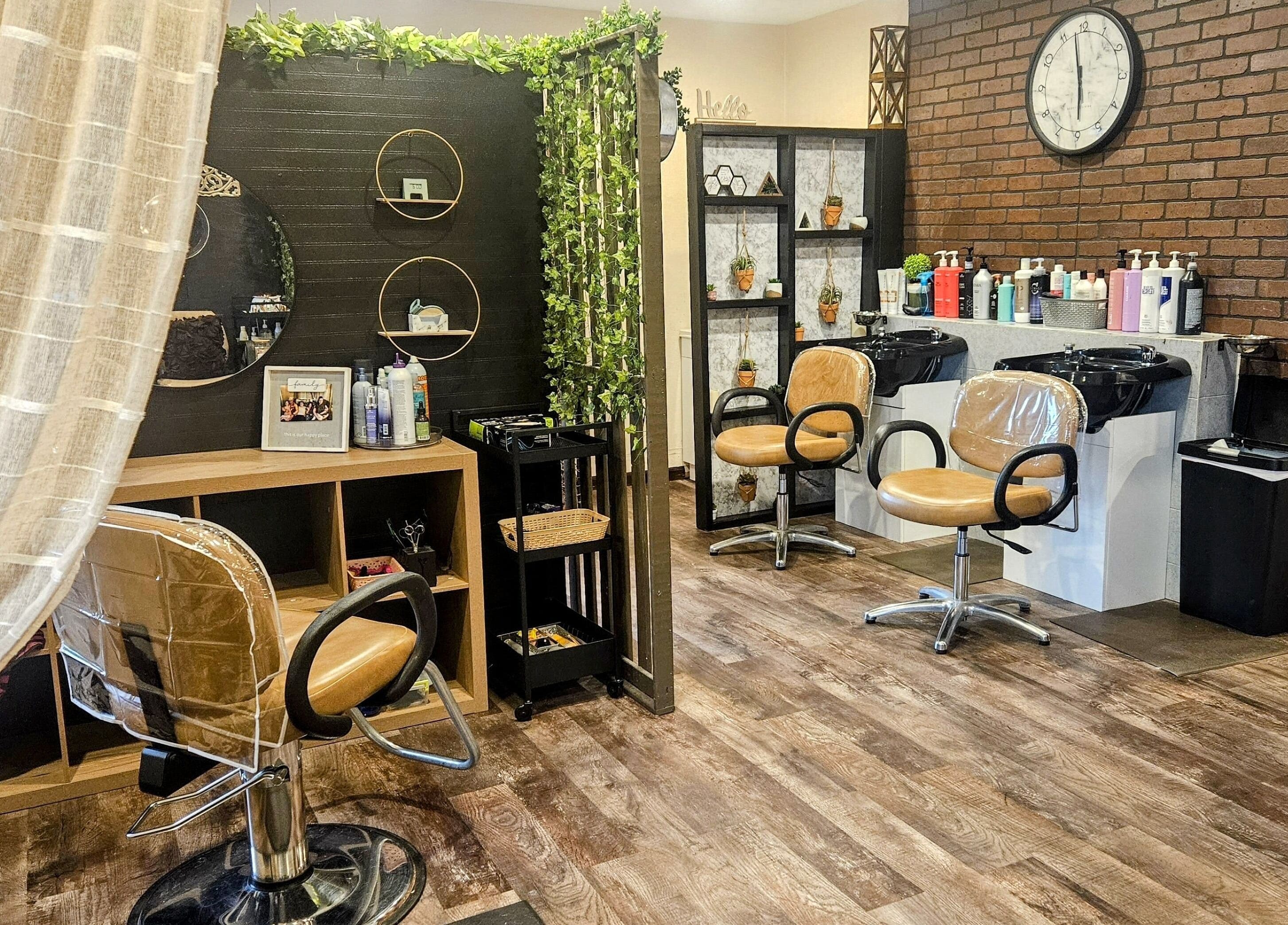 Cozy salon interior at Simply Suite, Lima, Ohio, US with stylish chairs and decor.