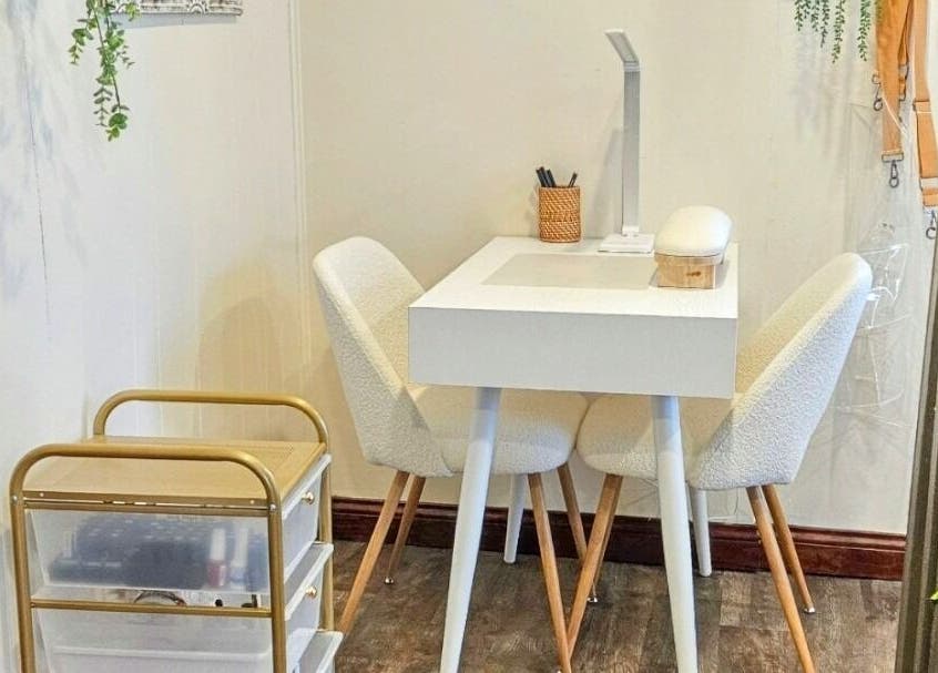 Elegant nail care station at Simply Suite, Lima, Ohio, US, with chic decor and comfy seating.